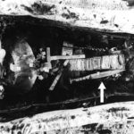 The mummy of King Tutankhamun. Black and white picture of Tutankhamun mummy showing the iron dagger (34.2 cm long) placed on the right thigh (arrowed)..© Griffith Institute, University of Oxford